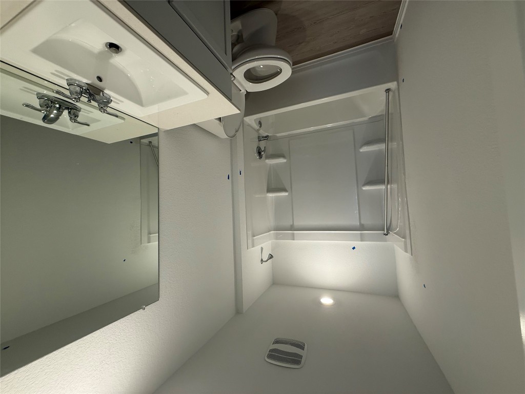 120 Cattle Queen Road Jarrell, TX 76537 - Photo 4 of 9 a bathroom with a sink a toilet and shower