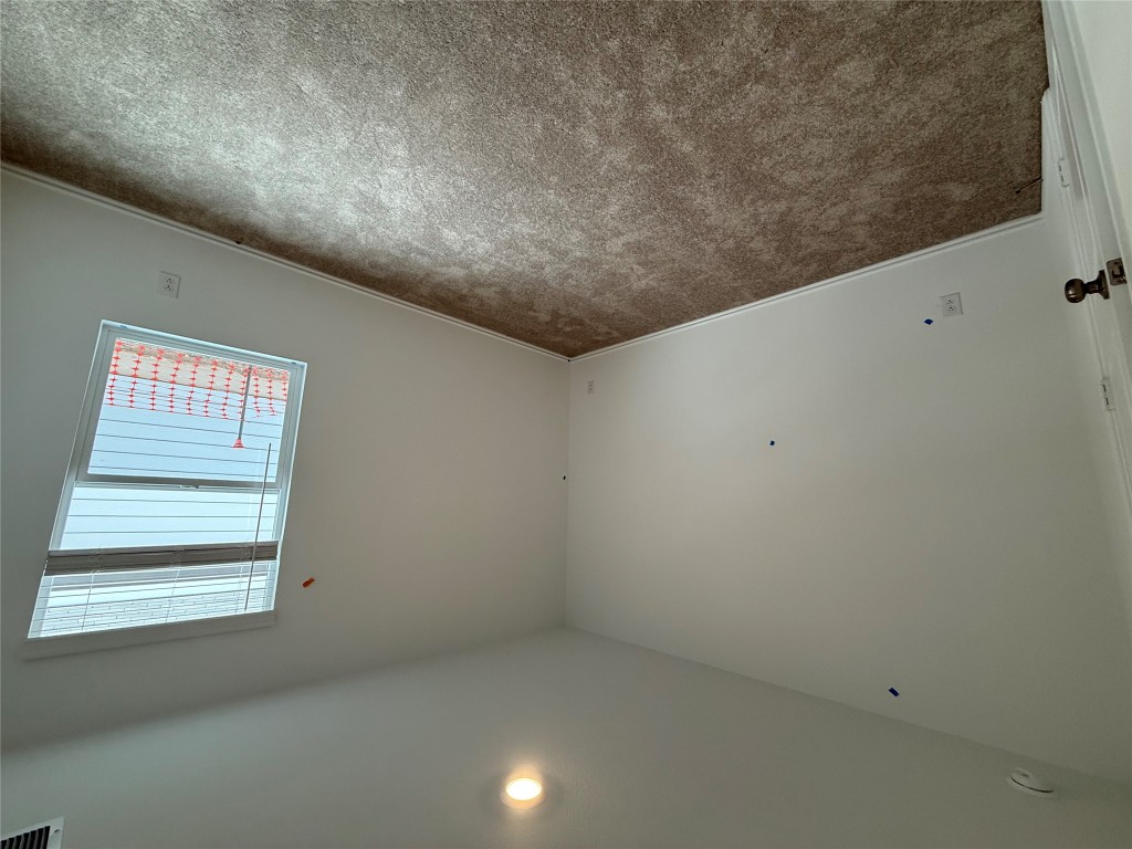 120 Cattle Queen Road Jarrell, TX 76537 - Photo 5 of 9 an empty room with a window