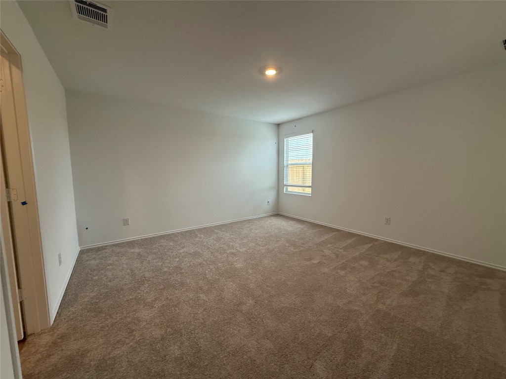 120 Cattle Queen Road Jarrell, TX 76537 - Photo 8 of 9 an empty room with windows and closet