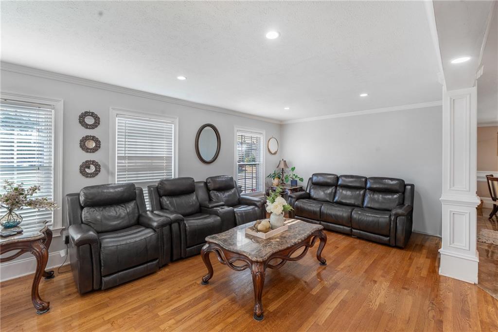4983 Arcado Road Southwest Lilburn, GA 30047 - Photo 15 of 33 a living room with furniture and wooden floor