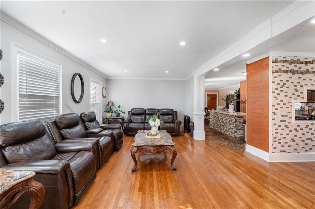 4983 Arcado Road Southwest Lilburn, GA 30047 - Photo 16 of 33 a living room with furniture a rug and wooden floor