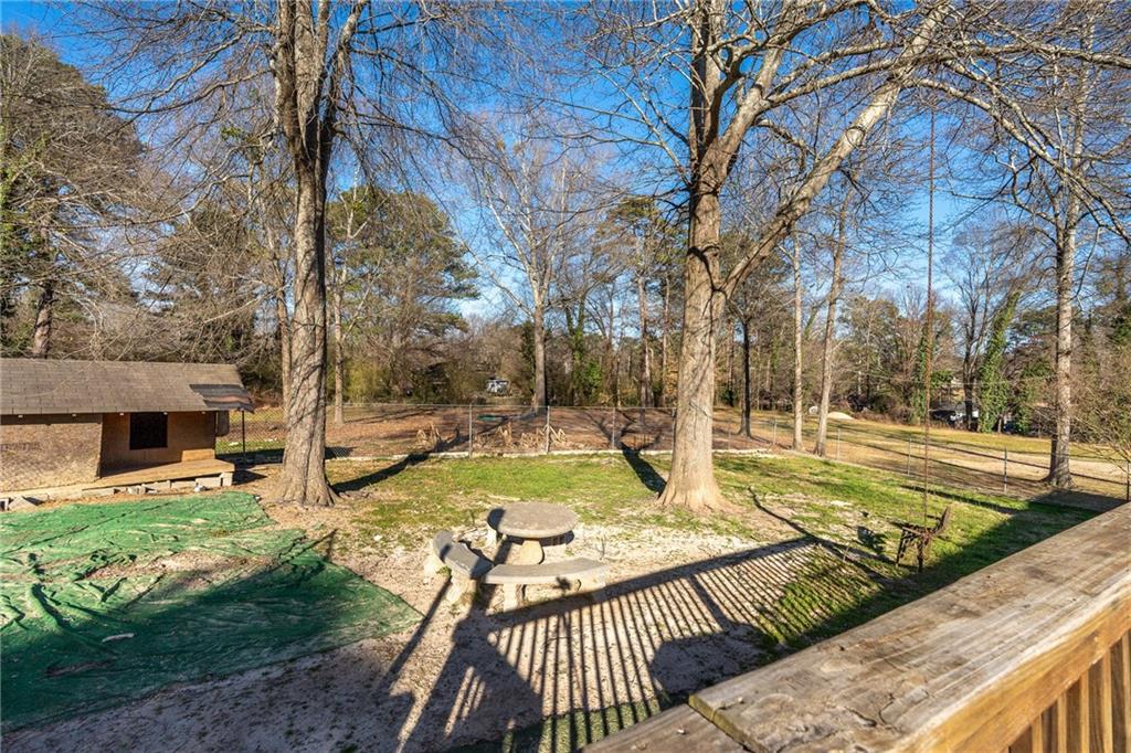 4983 Arcado Road Southwest Lilburn, GA 30047 - Photo 27 of 33 a view of a yard with sitting area