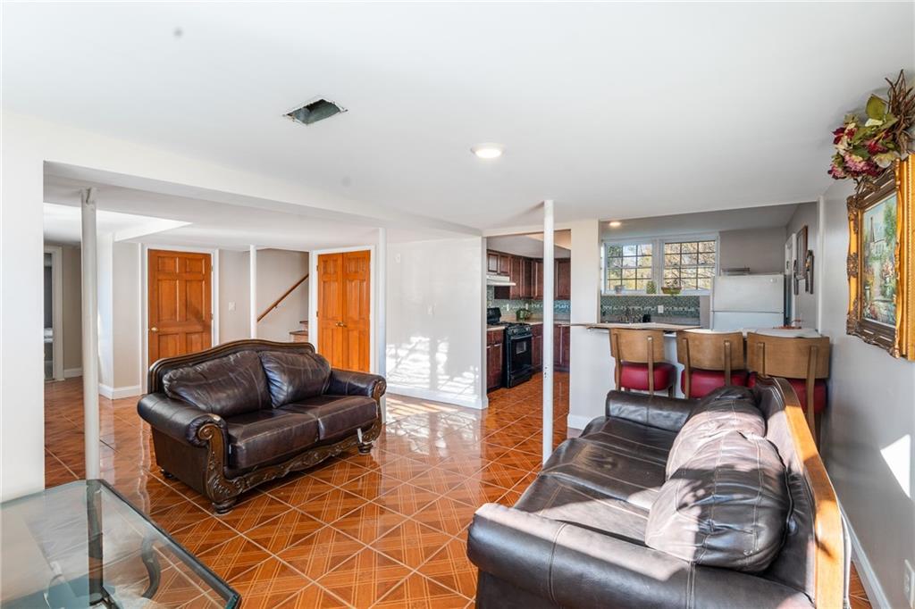 4983 Arcado Road Southwest Lilburn, GA 30047 - Photo 29 of 33 a living room with furniture or couch and a potted plant