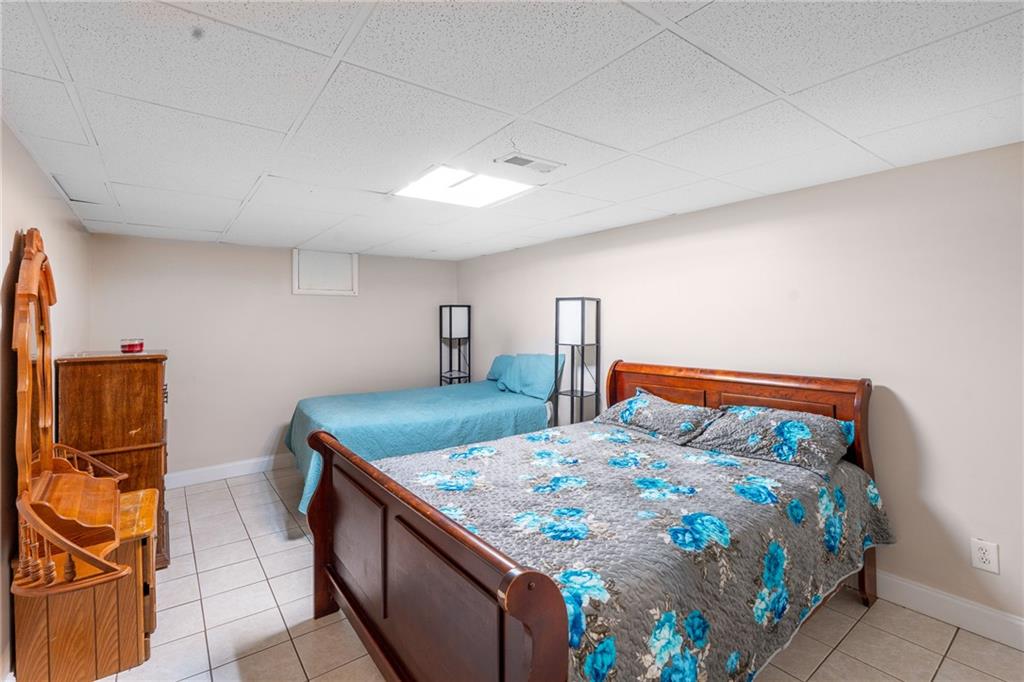 4983 Arcado Road Southwest Lilburn, GA 30047 - Photo 33 of 33 a bedroom with a bed and dresser