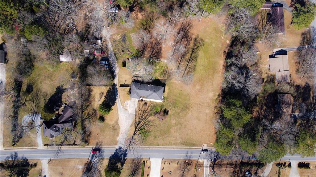 4983 Arcado Road Southwest Lilburn, GA 30047 - Photo 8 of 33 an aerial view of a residential houses with outdoor space
