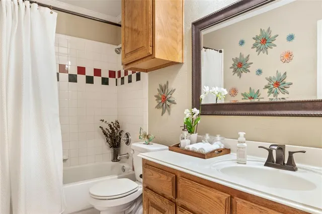 a bathroom with a sink a toilet and a bathtub