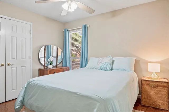 a large bed sitting in a bedroom next to a window
