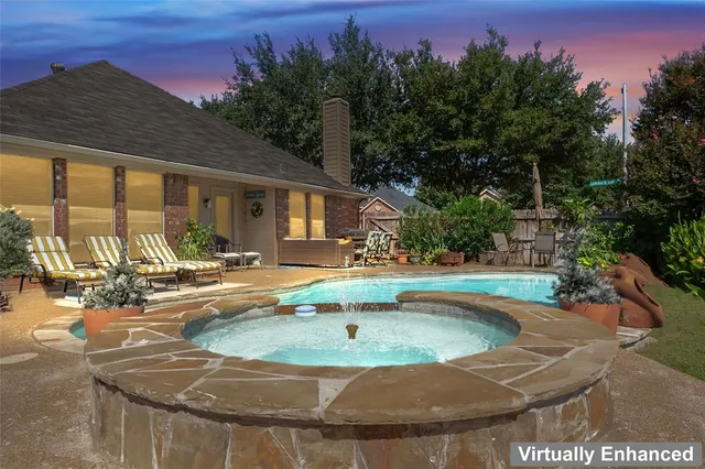 a view of a house with swimming pool and a yard