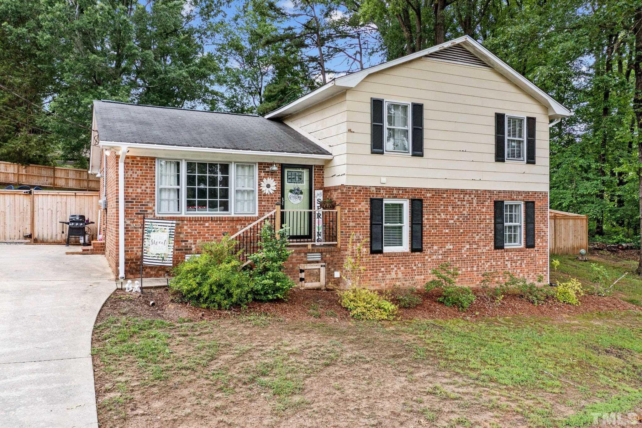 1225 Dover Street Roxboro, NC 27573 - Photo 1 of 37 a front view of a house with garden
