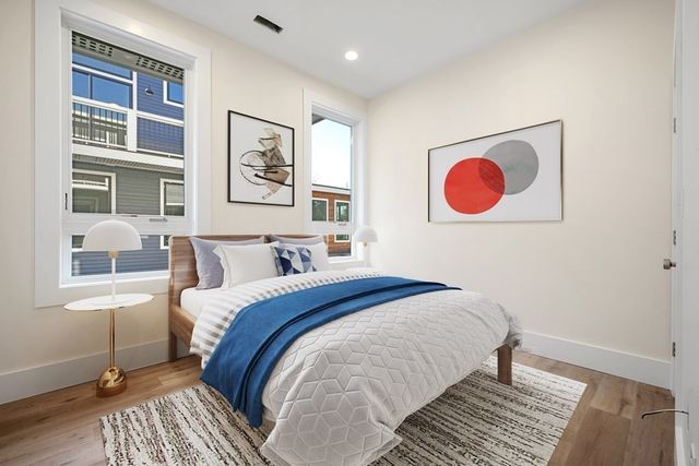 a bed room with a bed and a window