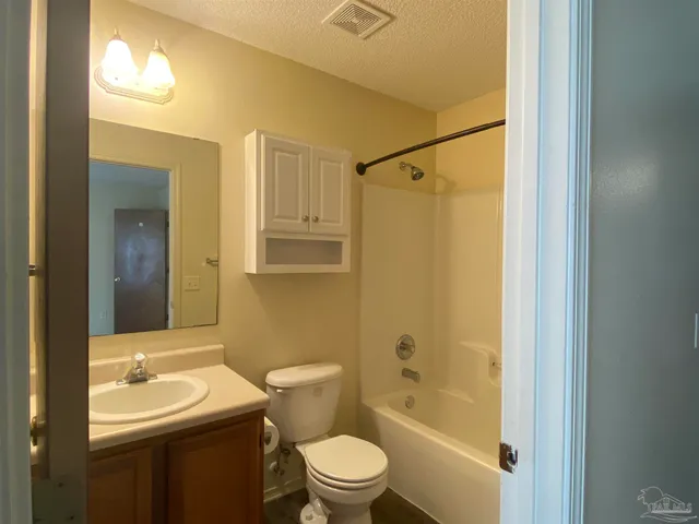 a bathroom with a toilet a sink and a bathtub