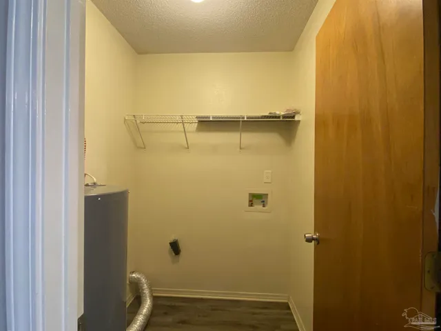 an empty room with a fan and a fan