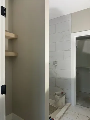 a bathroom with a toilet and shower