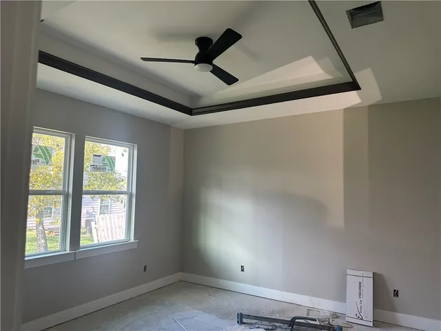 a view of room with a ceiling fan