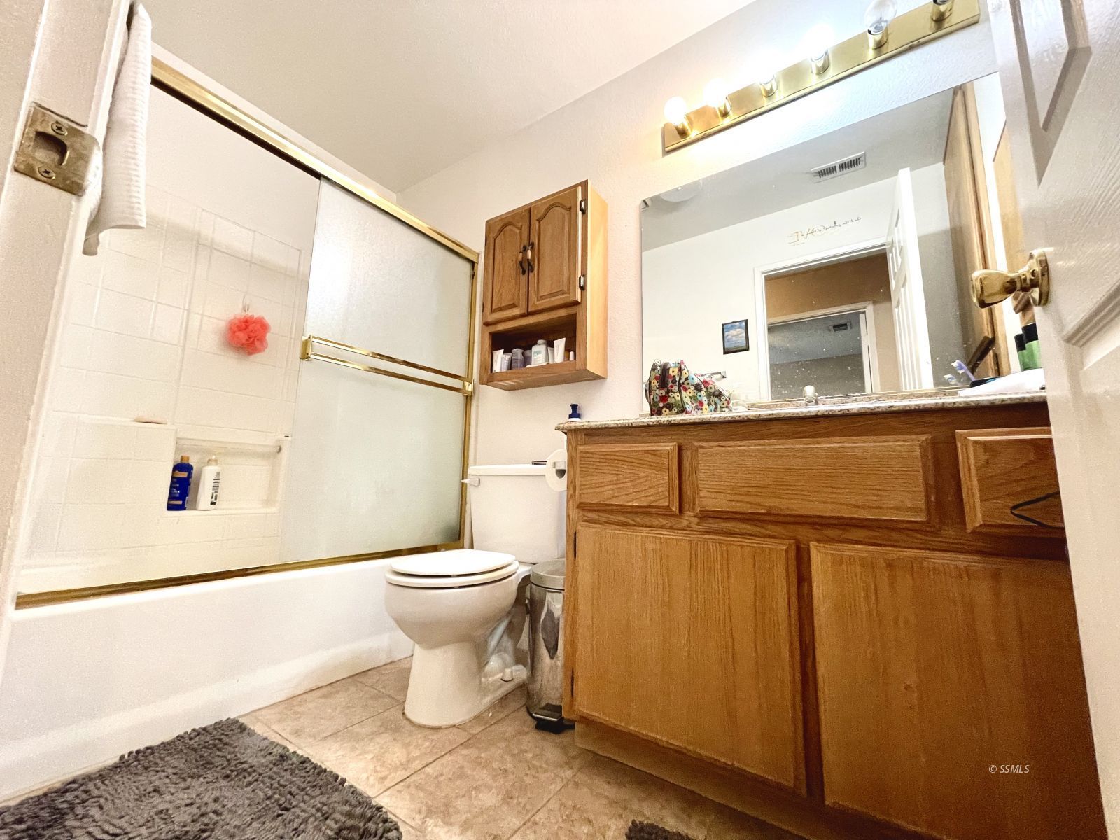 529 South Allen Street Ridgecrest, CA 93555 - Photo 11 of 17 a bathroom with a toilet sink and mirror
