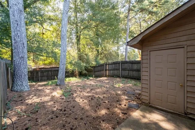a backyard of a house with lots of green space