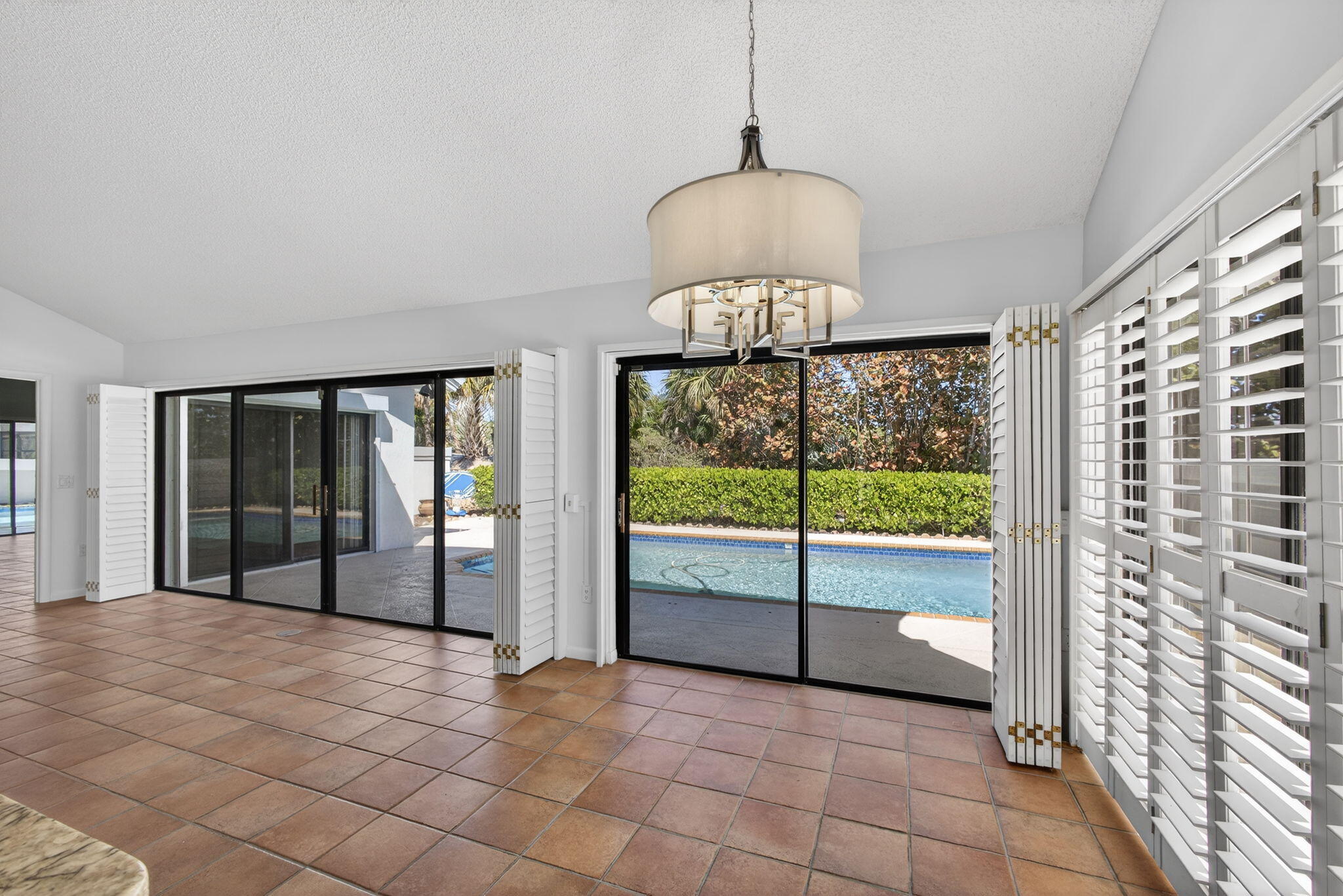 239 Ridge Road Jupiter, FL 33477 - Photo 21 of 75 a view of an empty room with glass door