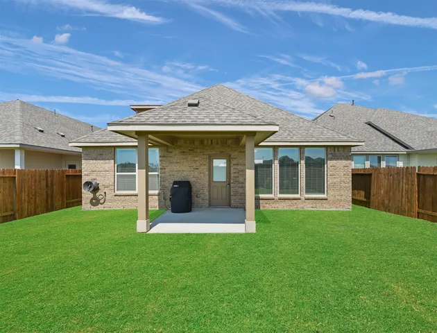 a front view of a house with a yard and porch