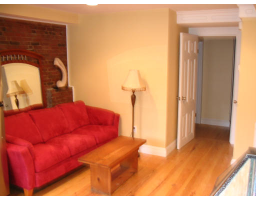 19 Emerson Street, Unit 1 Boston, MA 02127 - Photo 3 of 14 a living room with furniture and a wooden floor