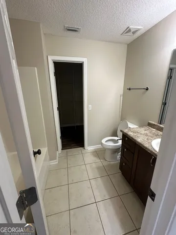 a bathroom with a sink and toilet