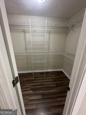 a bathroom with a shower and a sink