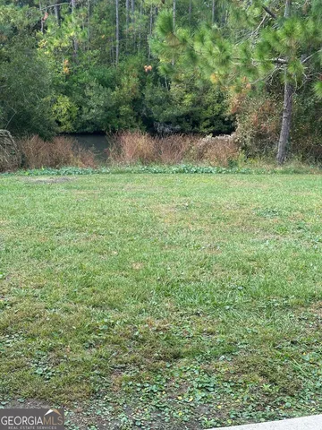 a view of lake with green space