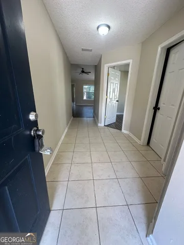 a view of an empty room with a fireplace