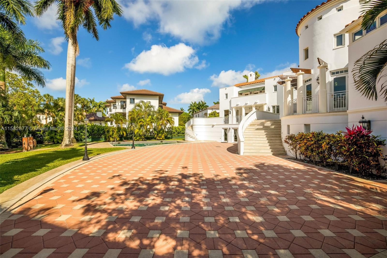 431 Costanera Road Coral Gables, FL 33143 - Photo 21 of 33 a view of a street with a building in the background