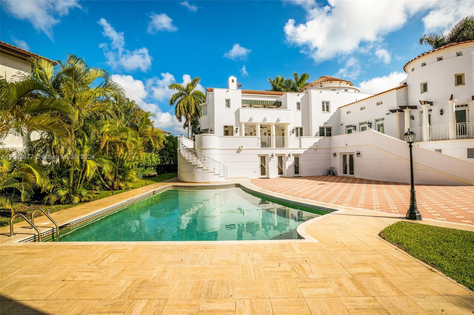 431 Costanera Road Coral Gables, FL 33143 - Photo 22 of 33 a view of a swimming pool with a patio