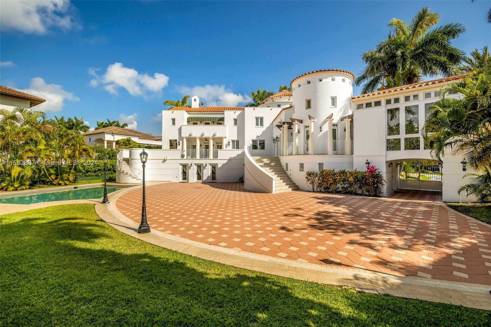431 Costanera Road Coral Gables, FL 33143 - Photo 23 of 33 a view of a house with a yard and pathway