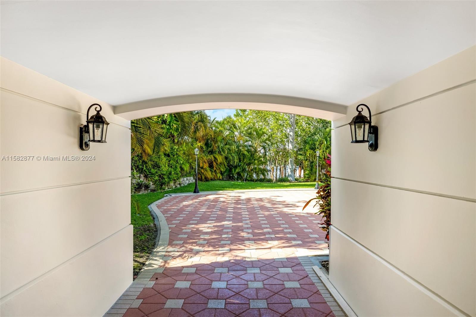 431 Costanera Road Coral Gables, FL 33143 - Photo 27 of 33 a view of a porch with a yard