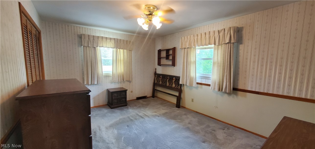 1515 East Bogart Road Sandusky, OH 44870 - Photo 16 of 23 Unfurnished bedroom with light carpet and ceiling fan