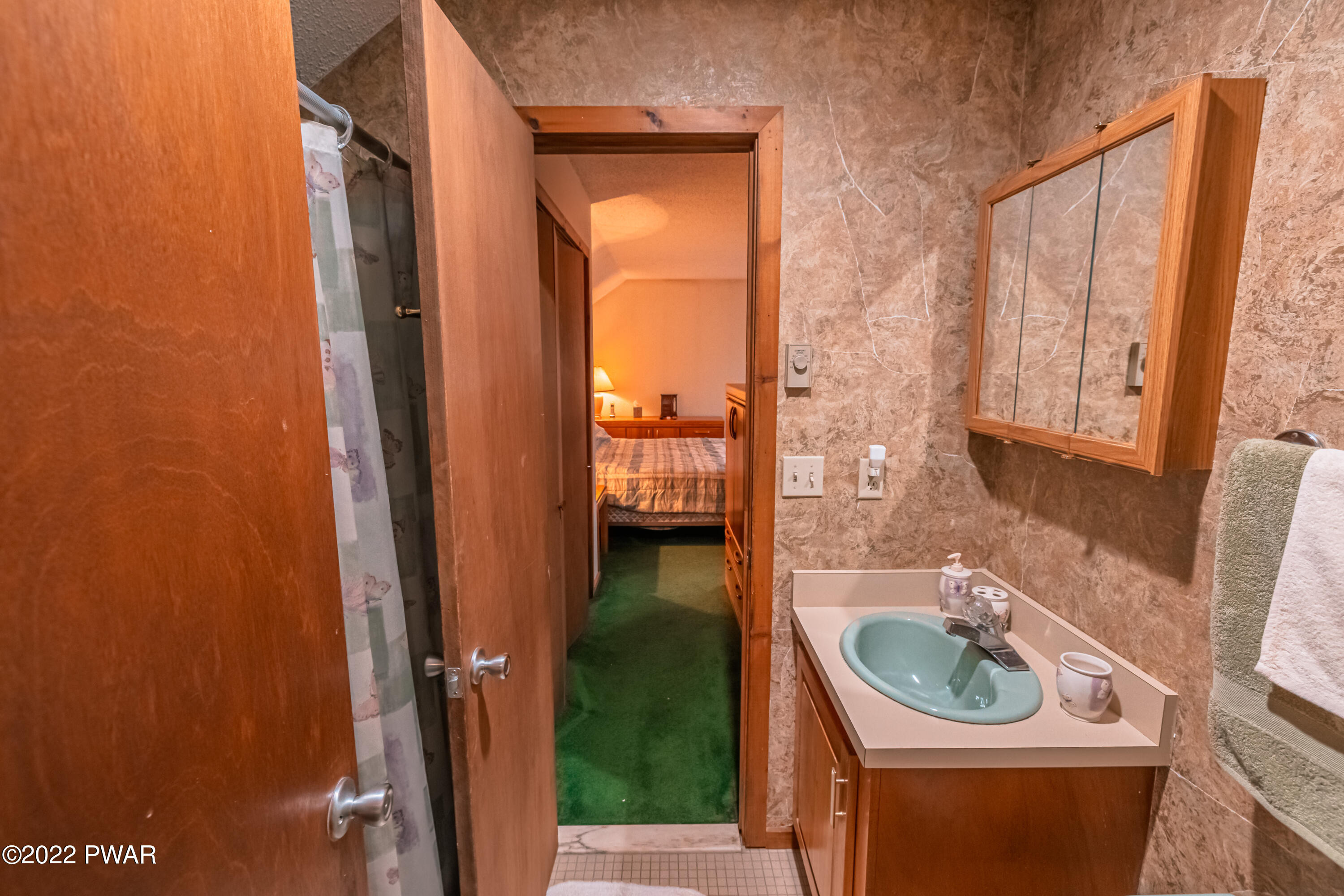 4141 Winchester Way Bushkill, PA 18324 - Photo 39 of 75 a bathroom with a sink a toilet and shower