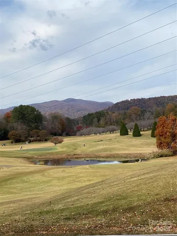 a view of a lake with a yard