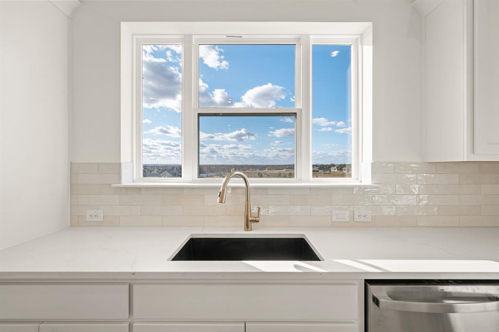 412 Caprock Lane Azle, TX 76020 - Photo 14 of 40 a sink sitting next to a window
