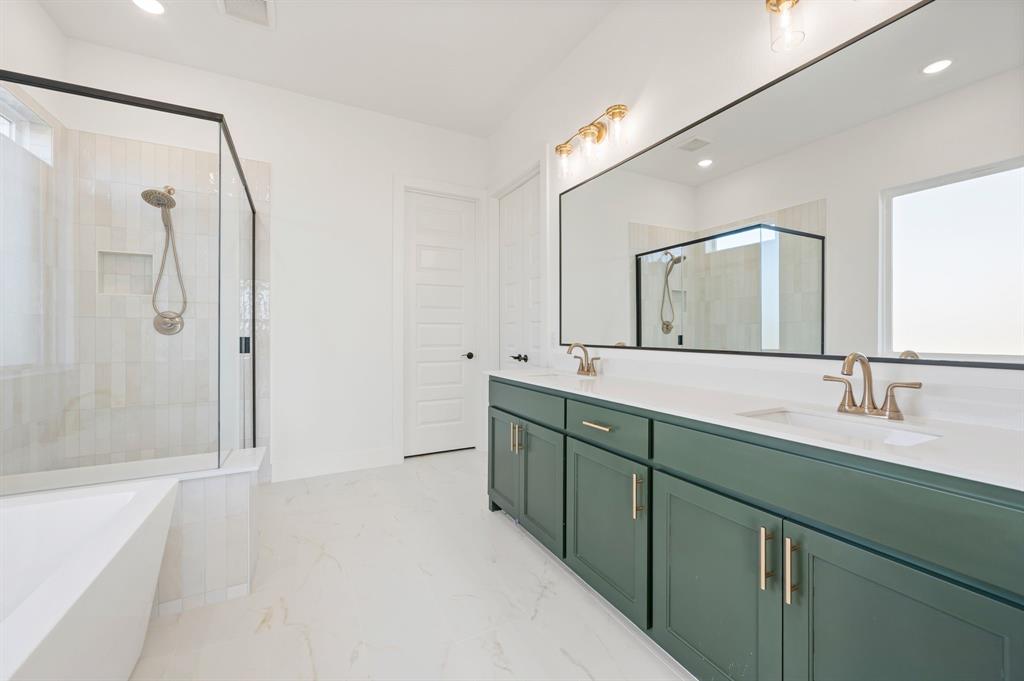 412 Caprock Lane Azle, TX 76020 - Photo 21 of 40 a bathroom with a double vanity sink mirror and shower
