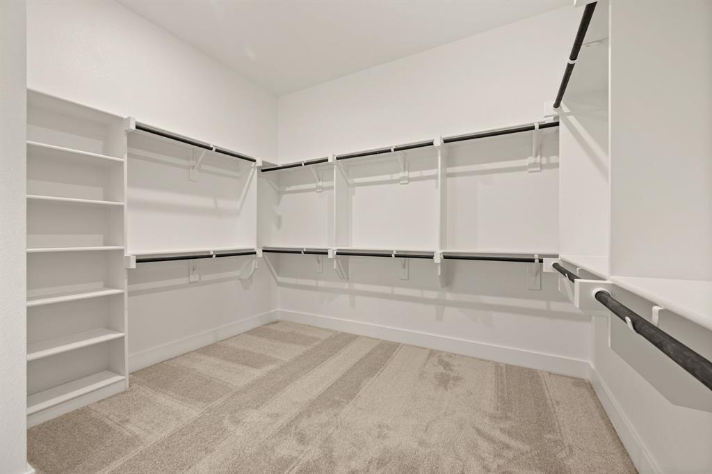 412 Caprock Lane Azle, TX 76020 - Photo 24 of 40 a walk in closet with empty racks
