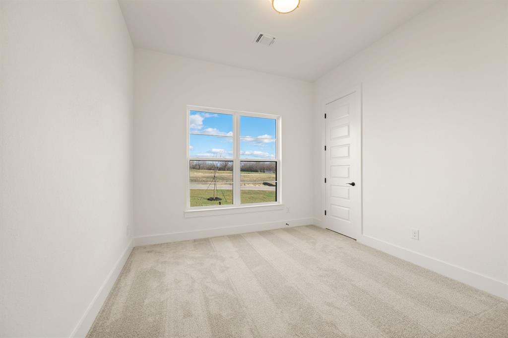 412 Caprock Lane Azle, TX 76020 - Photo 29 of 40 an empty room with a window