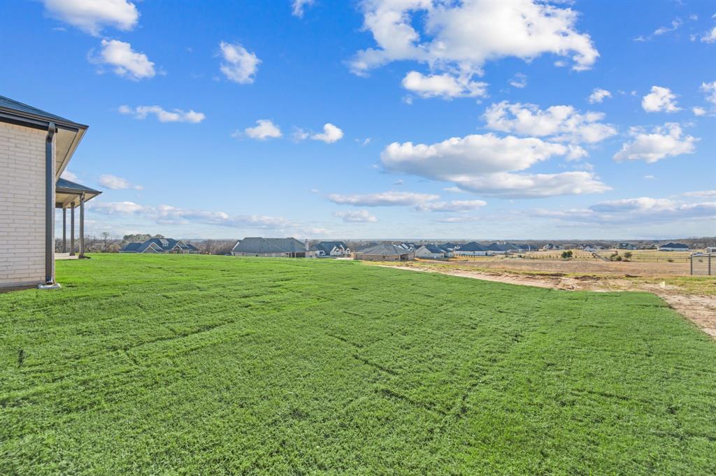 412 Caprock Lane Azle, TX 76020 - Photo 37 of 40 a view of a lake with a yard
