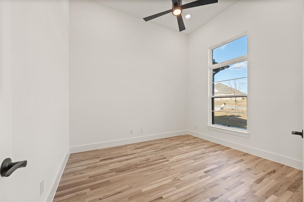 412 Caprock Lane Azle, TX 76020 - Photo 5 of 40 wooden floor in an empty room