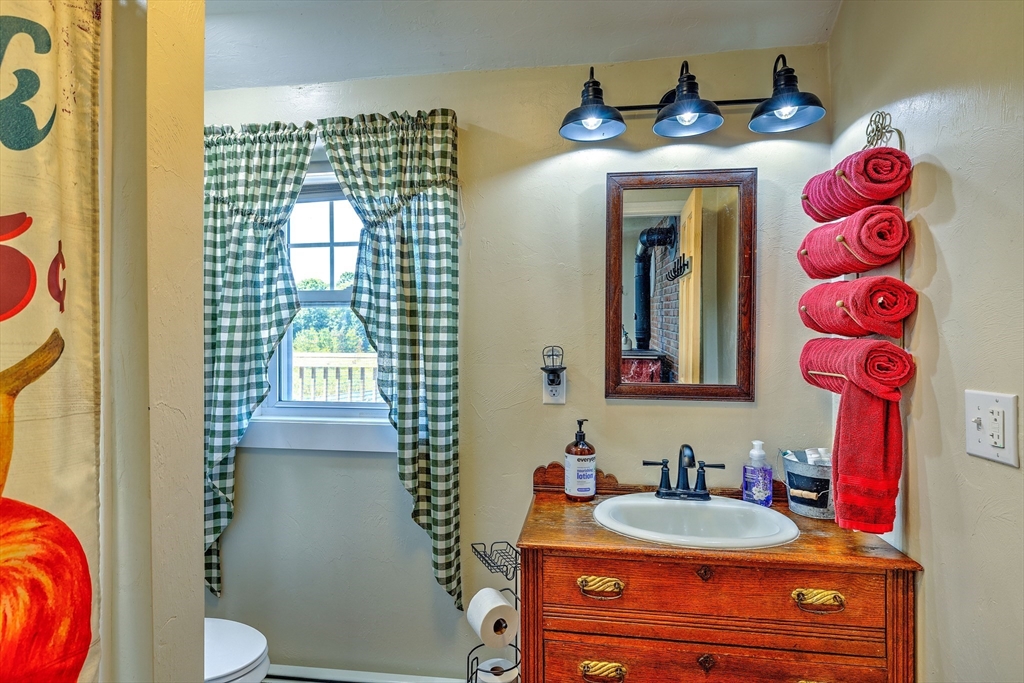 43 Rufus Putnam Road North Brookfield, MA 01535 - Photo 19 of 42 a bathroom with a sink mirror and toilet