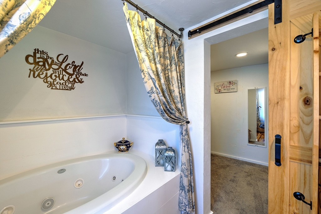 43 Rufus Putnam Road North Brookfield, MA 01535 - Photo 24 of 42 a bathroom with a bathtub and a shower
