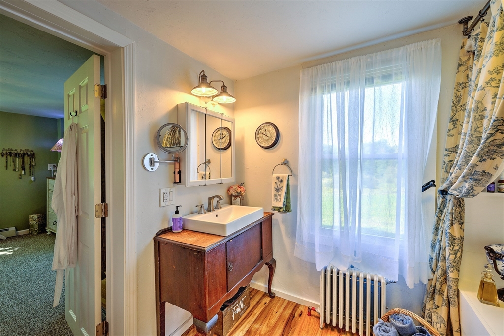 43 Rufus Putnam Road North Brookfield, MA 01535 - Photo 27 of 42 a bathroom with a mirror a sink and a shower