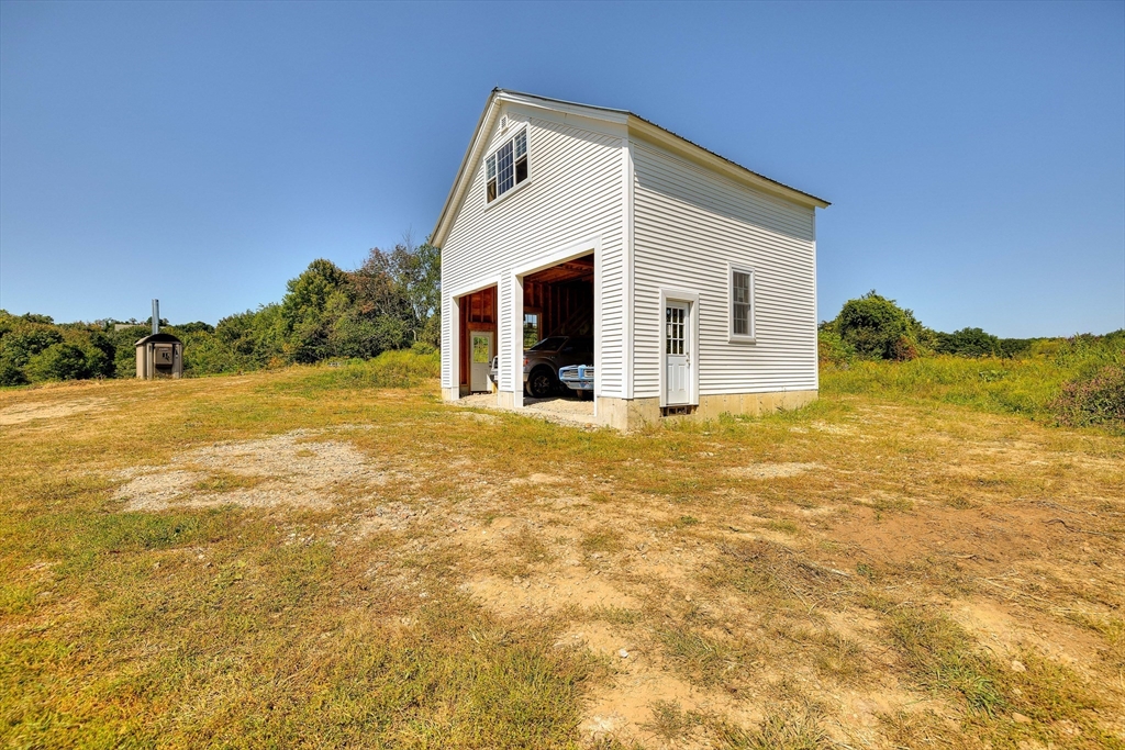 43 Rufus Putnam Road North Brookfield, MA 01535 - Photo 6 of 42 a view of a house with a yard and garage