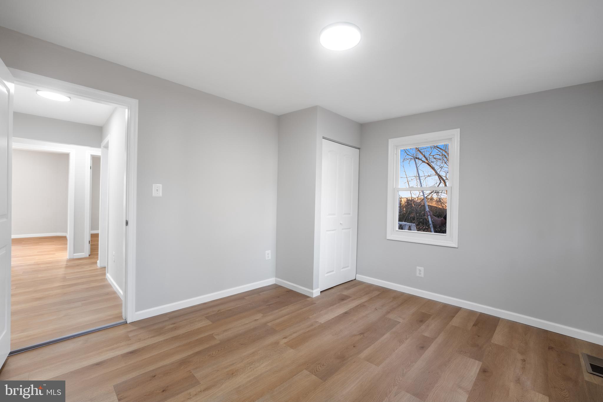 497 Bruce Avenue Odenton, MD 21113 - Photo 22 of 38 a view of a big room with wooden floor and windows