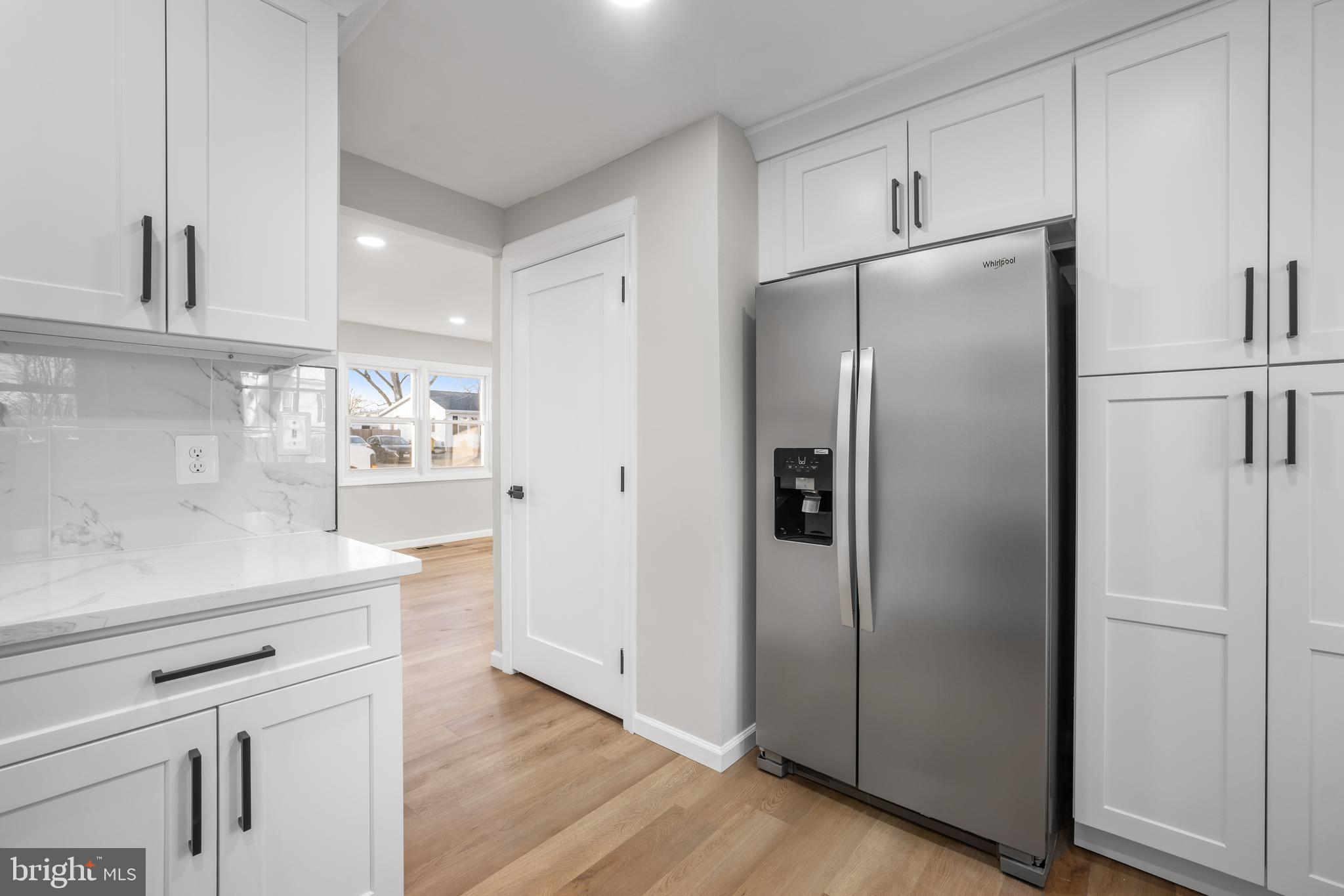 497 Bruce Avenue Odenton, MD 21113 - Photo 6 of 38 a kitchen with stainless steel appliances a refrigerator and cabinets