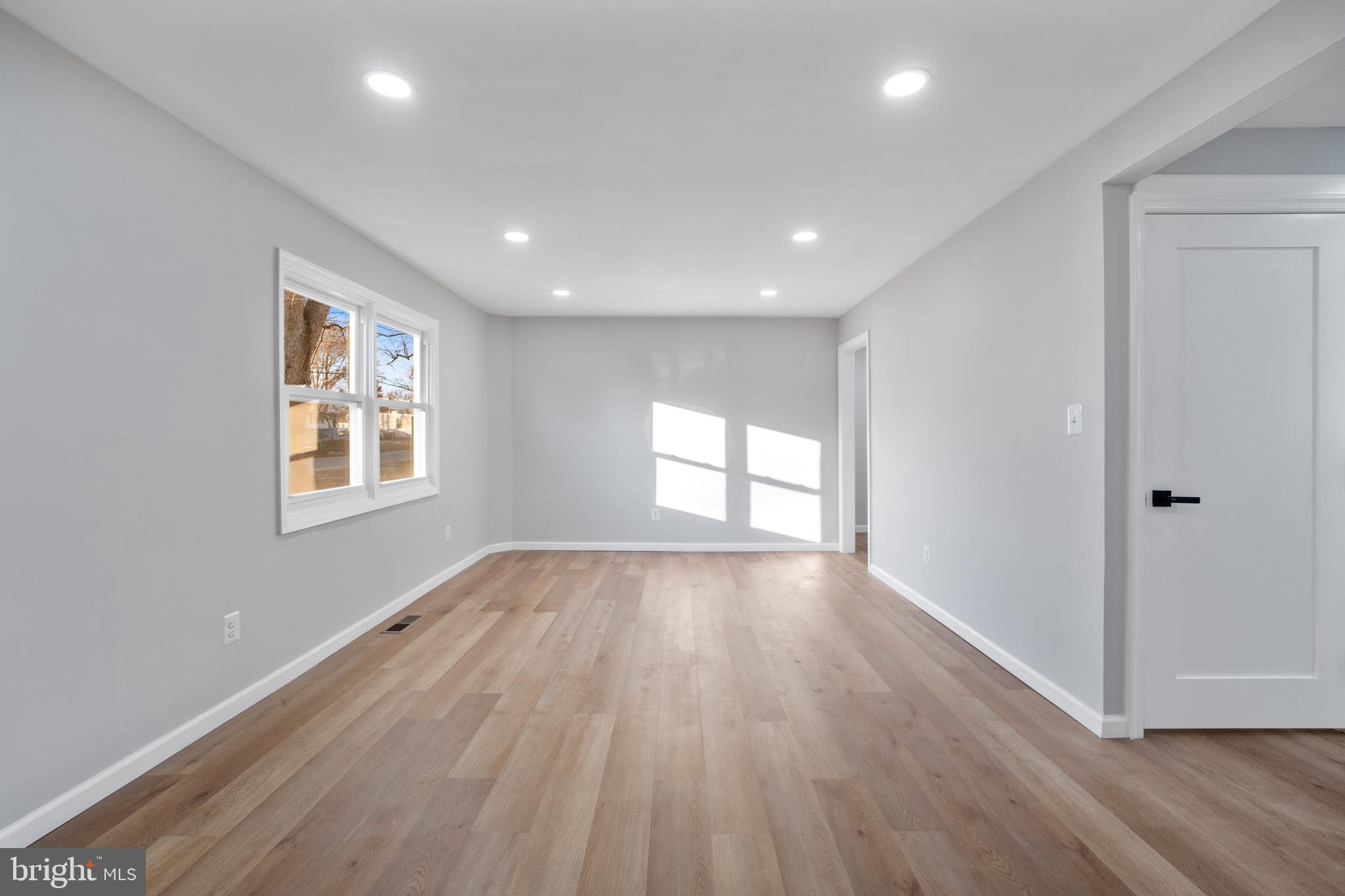497 Bruce Avenue Odenton, MD 21113 - Photo 8 of 38 a view of empty room with wooden floor and fan