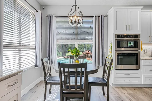 a dining room with furniture and window