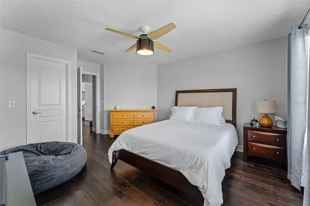 a bedroom with a bed and couch