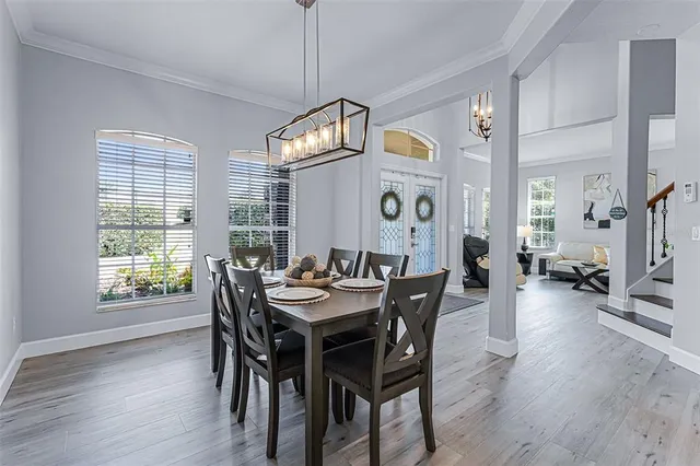 a view of a dining room with furniture window and wooden floor